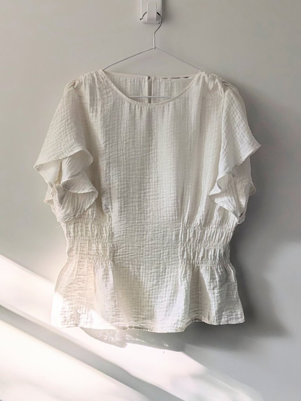 Ivory White Ruffle Sleeve Peplum Top
